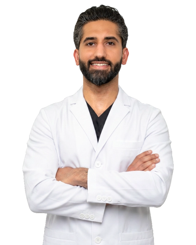 Professional headshot of Dr. Usman Yousaf wearing a white lab coat, smiling at the camera against a black background. This is a standard medical professional portrait used for clinic or practice identification.